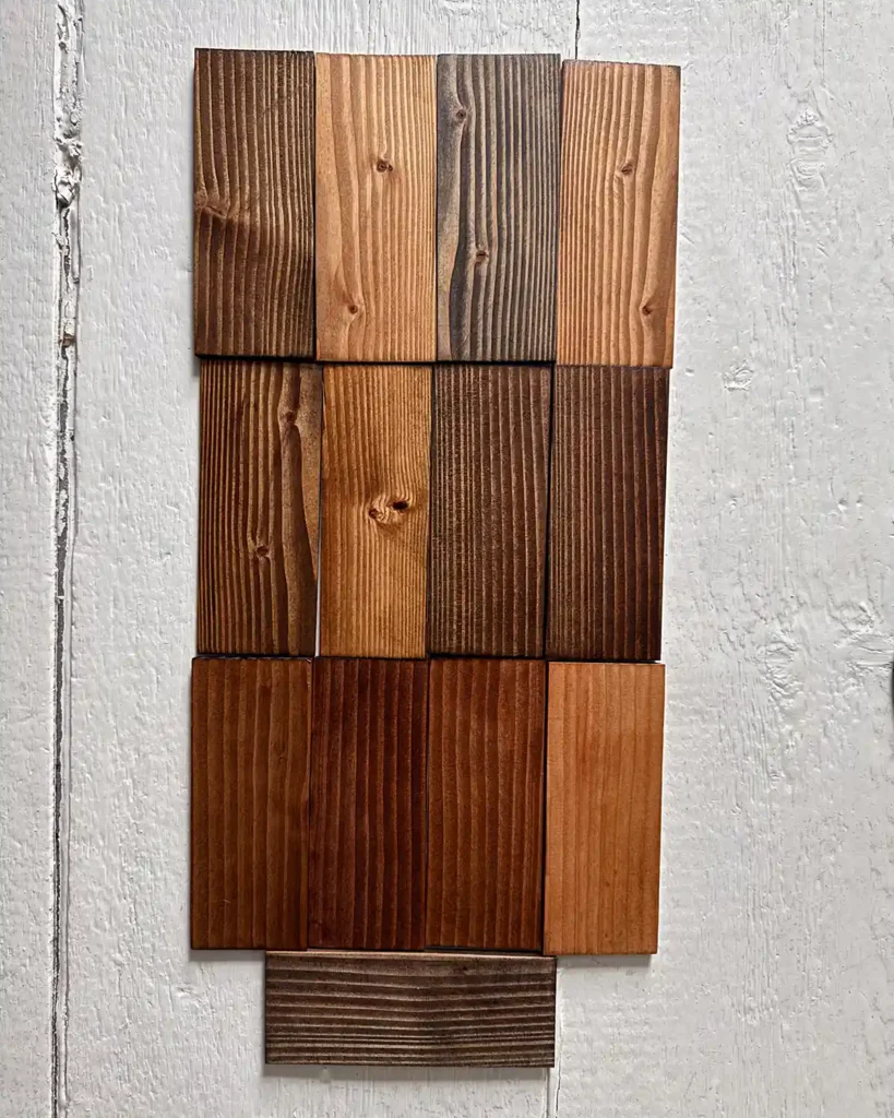 Testing all of the dark Minwax stains on samples of douglas fir wood; colors include Dark Walnut, Early American, Ebony, English Chestnut, Espresso, Honey, Jacobean, Mocha, Provincial, Red Mahogany, Red Oak, Special Walnut, and True Black