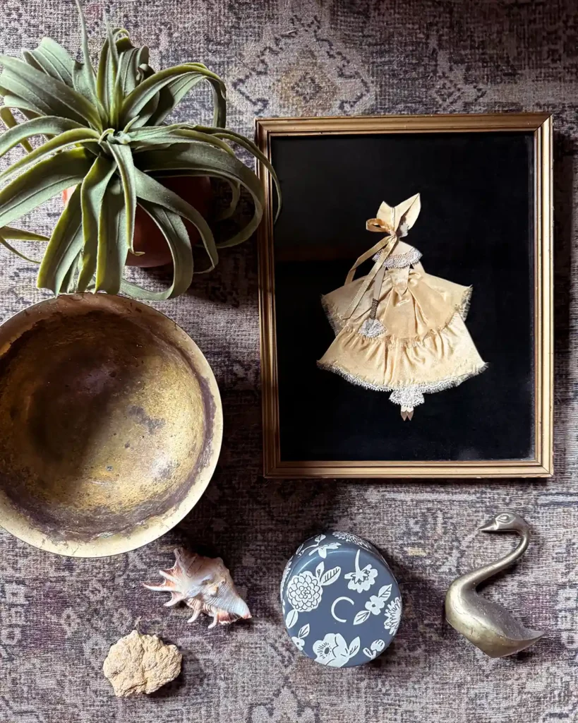 Playing with a home decor (art, succulent, shells, brass bowl, ceramic pot, brass swan) and creating a flat lay, an activity to help me find my creativity again