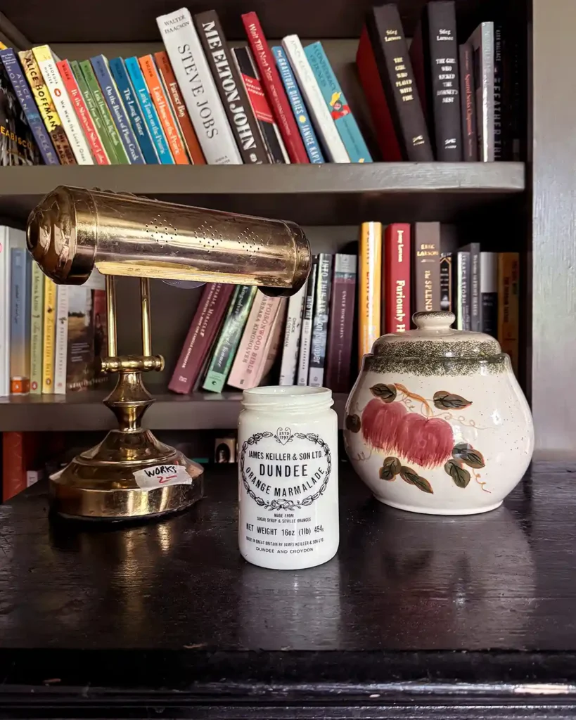 Thrifted treasures picked up in May 2025 including a desk lamp, vintage jelly jar, and ceramic canister