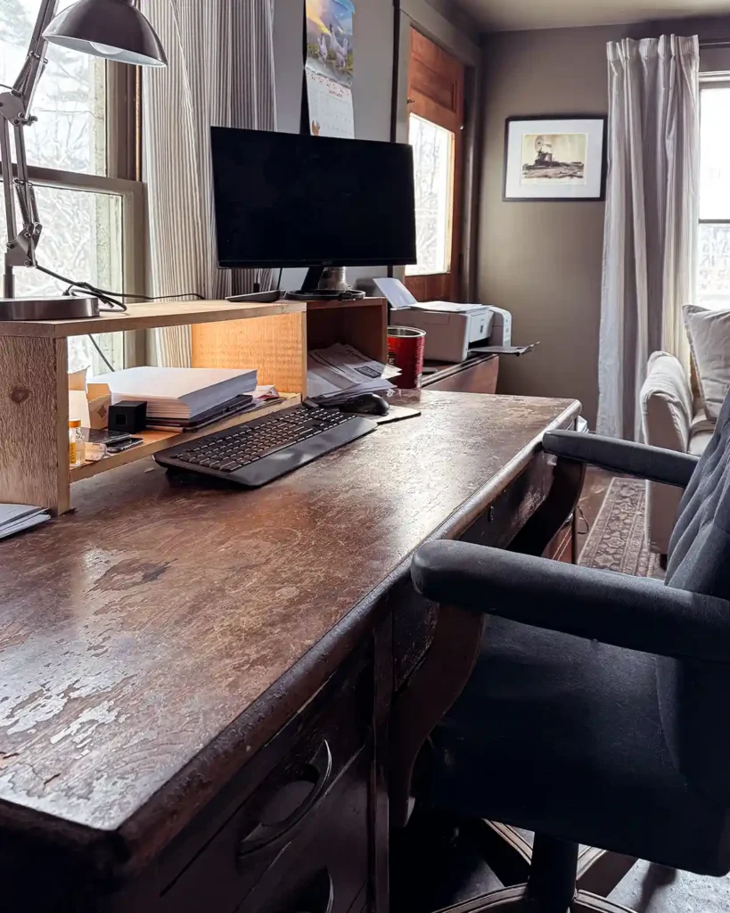 A decluttered home office desk with a usable work station and is ready for a round of office organizing