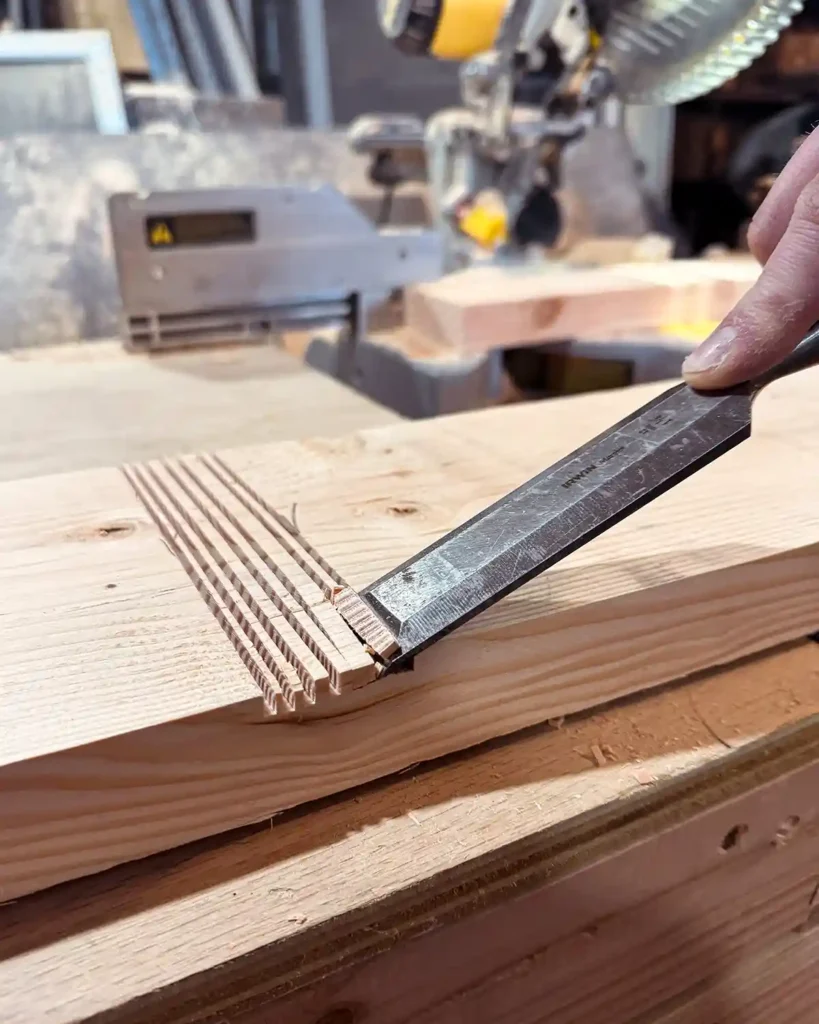 Chiseling out a groove in a wooden board