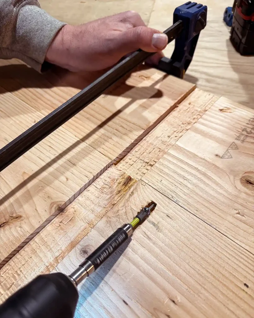 Clamping two shelf boards together and attaching them using pocket screws