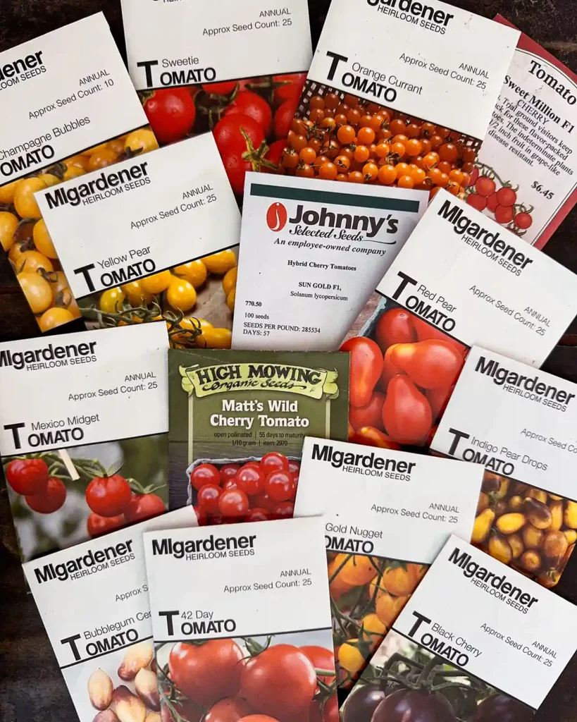Cherry and pear tomato seed packets for the 2026 planting season featuring, 42 Day, Black Cherry, Bubblegum Centiflor, Champagne Bubbles, Gold Nugget Cherry, Indigo Pear Drops, Matt’s Wild Cherry, Mexico Midget Cherry, Orange Currant, Red Pear, Sungold Cherry, Sweet Million Cherry, Sweetie Cherry, and Yellow Pear