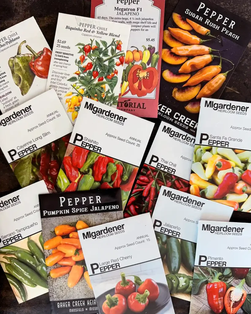 Hot Pepper seed packets for the 2026 planting season featuring Ancho Poblano Pepper, Biquinho Mix Pepper, Biquinho Pink Pepper, Cayenne Long Slim Pepper, Jalapeno Pepper, Large Red Cherry Pepper, Megatron Jalapeno Pepper, Pimento Pepper, Pumpkin Spice Jalapeno, Santa Fe Grande Pepper, Serrano Pepper, Shishito Pepper, Sugar Rush Peach Pepper, Thai Chili Pepper