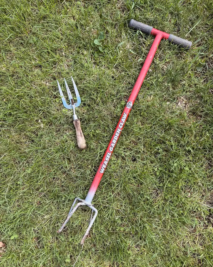 Two different garden fork styles, one small hand tool version and one stand-up twist fork style