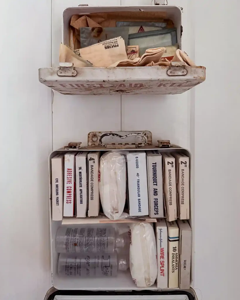Vintage supplies inside old first aid kits that are no longer usable
