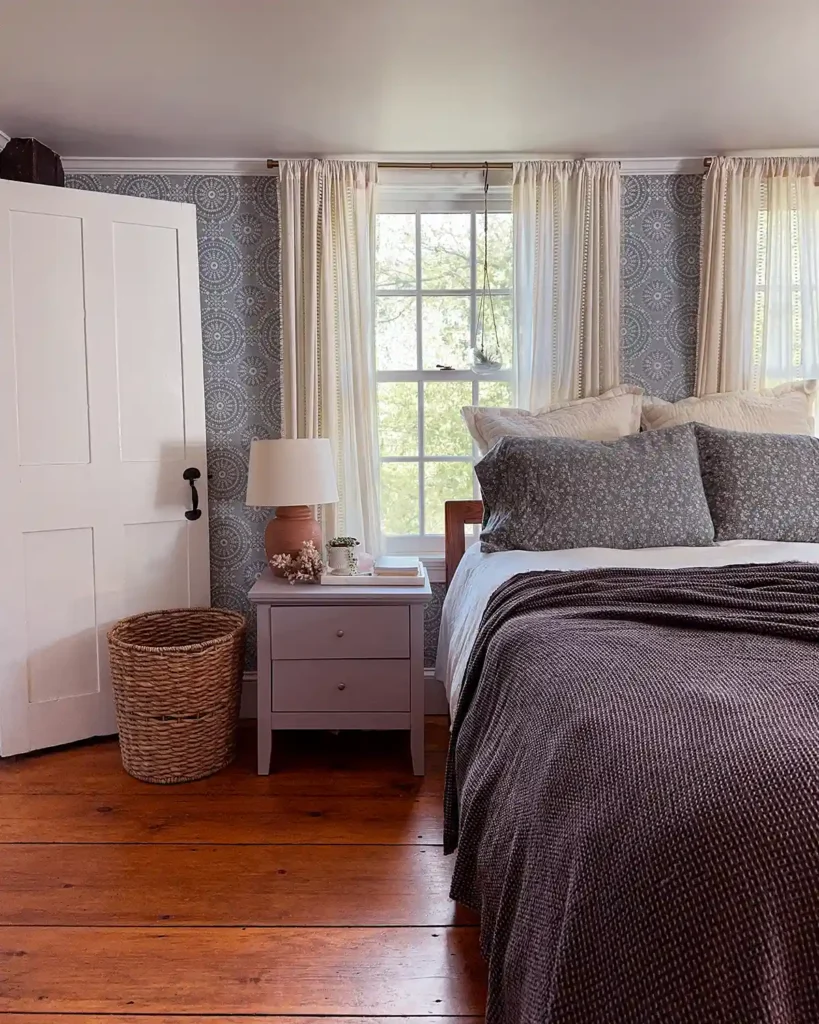 Adding a textured dark brown coverlet to layer over a set of blue floral flannel sheets to layer bedding for fall and cooler temperatures